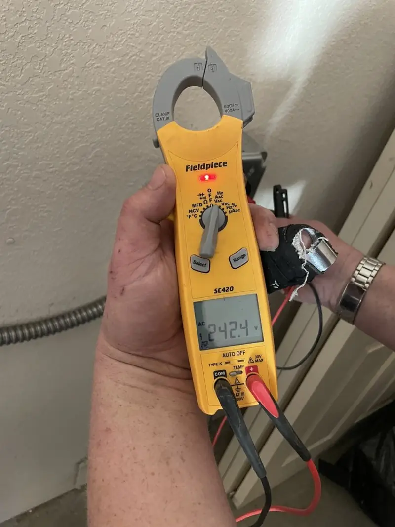 Voltage testing with clamp meter during Generator Installation in Tara Hills